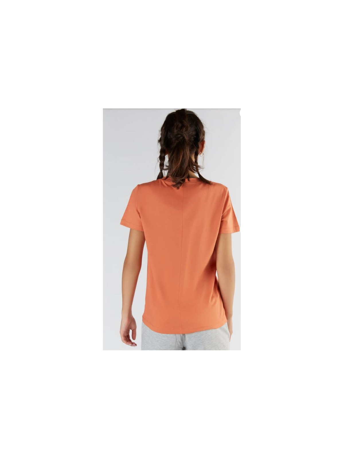 tee-shirt col rond large orange couture au milieu du dos