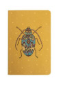 carnet fond ocre avec motif scarabée