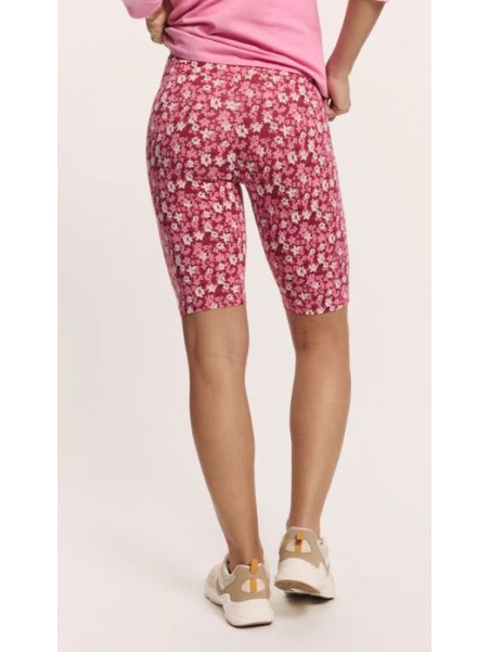 short cycliste longueur au-dessus du genou fleurs rouges sur fond blanc